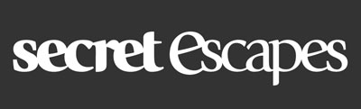 Das Logo von Secret Escapes in weiss